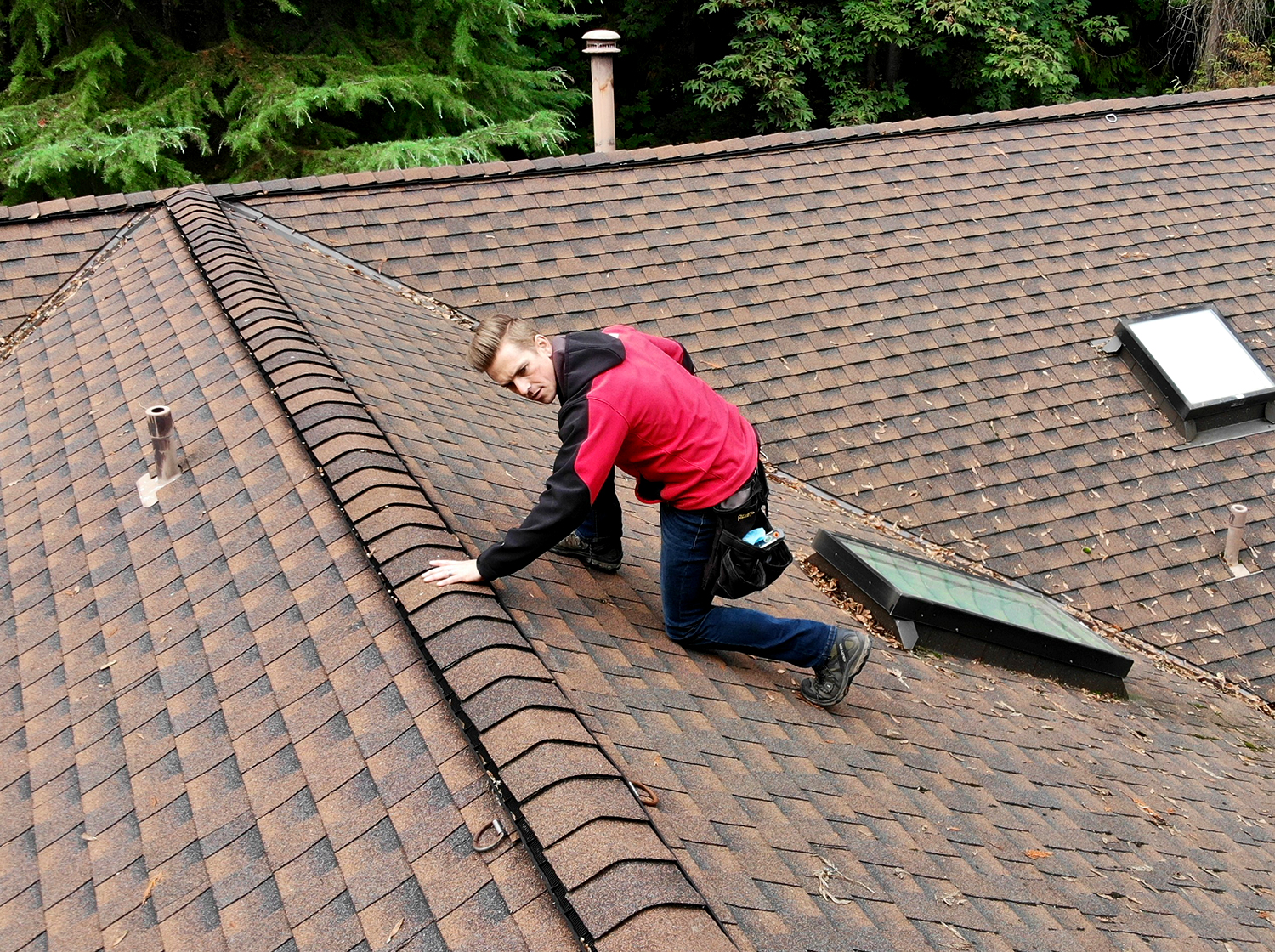 Home Inspector Kevin Swartz preforming a roof inspection. Photo created by dji camera.